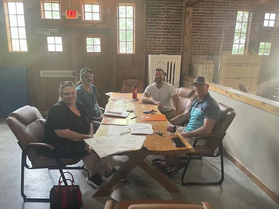 Group at closing table after cash home purchase — Dayton OH